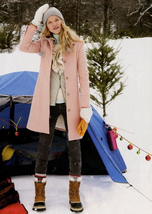 Woman wearing pastel clothes and snow boots